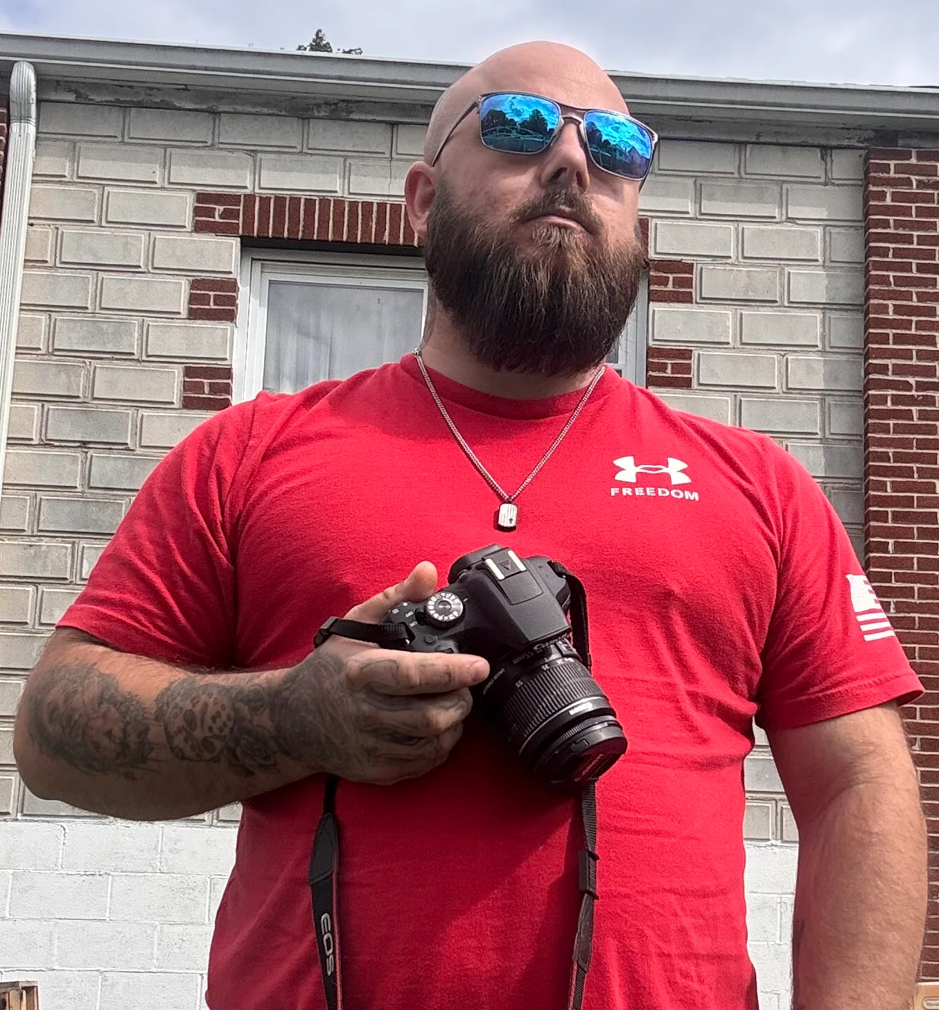 Ryan Fultz holding his Canon camera