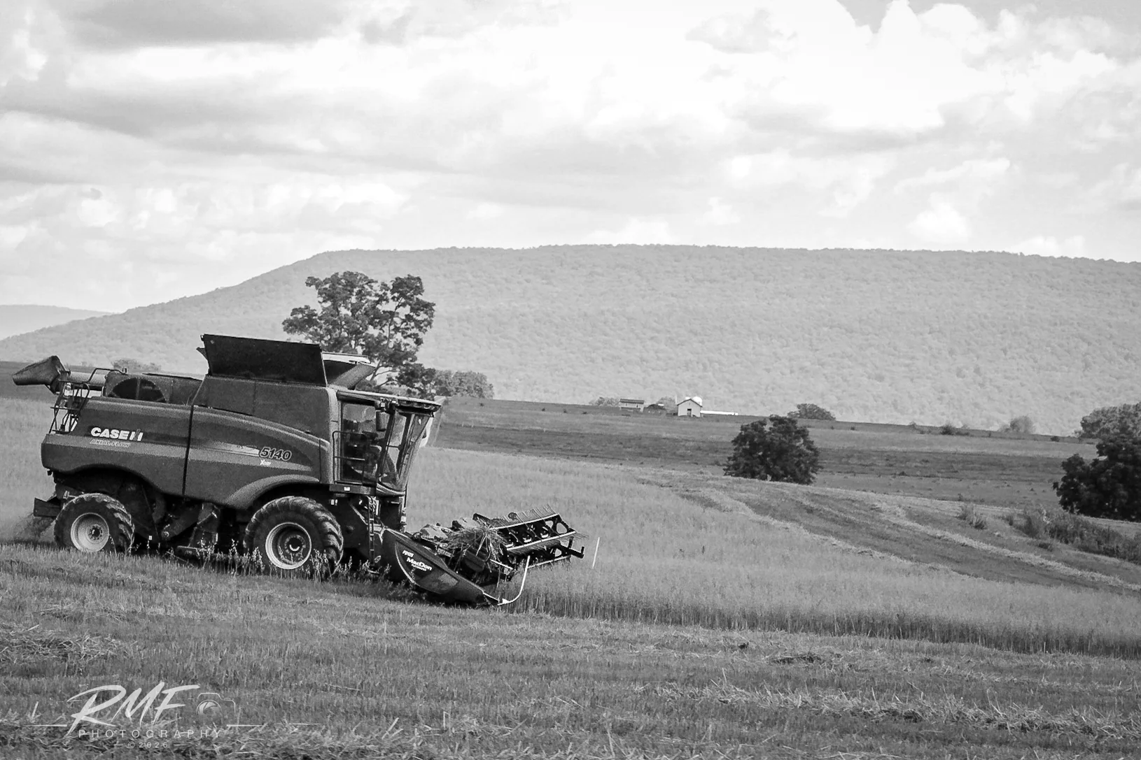 Combine harvester in a Central Pennsylvania farm landscape
