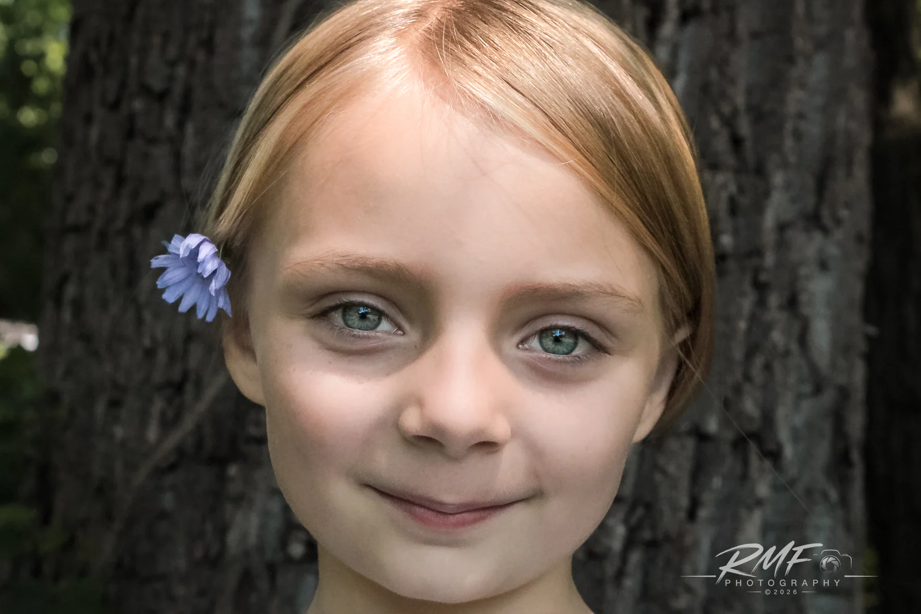 Outdoor portrait of a young girl photographed by RMF Photography