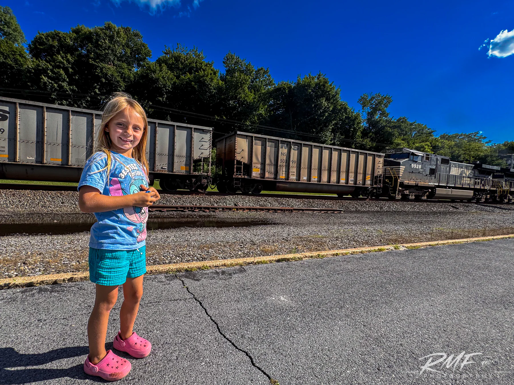 Child watching a Norfolk Southern freight train pass through Pennsylvania