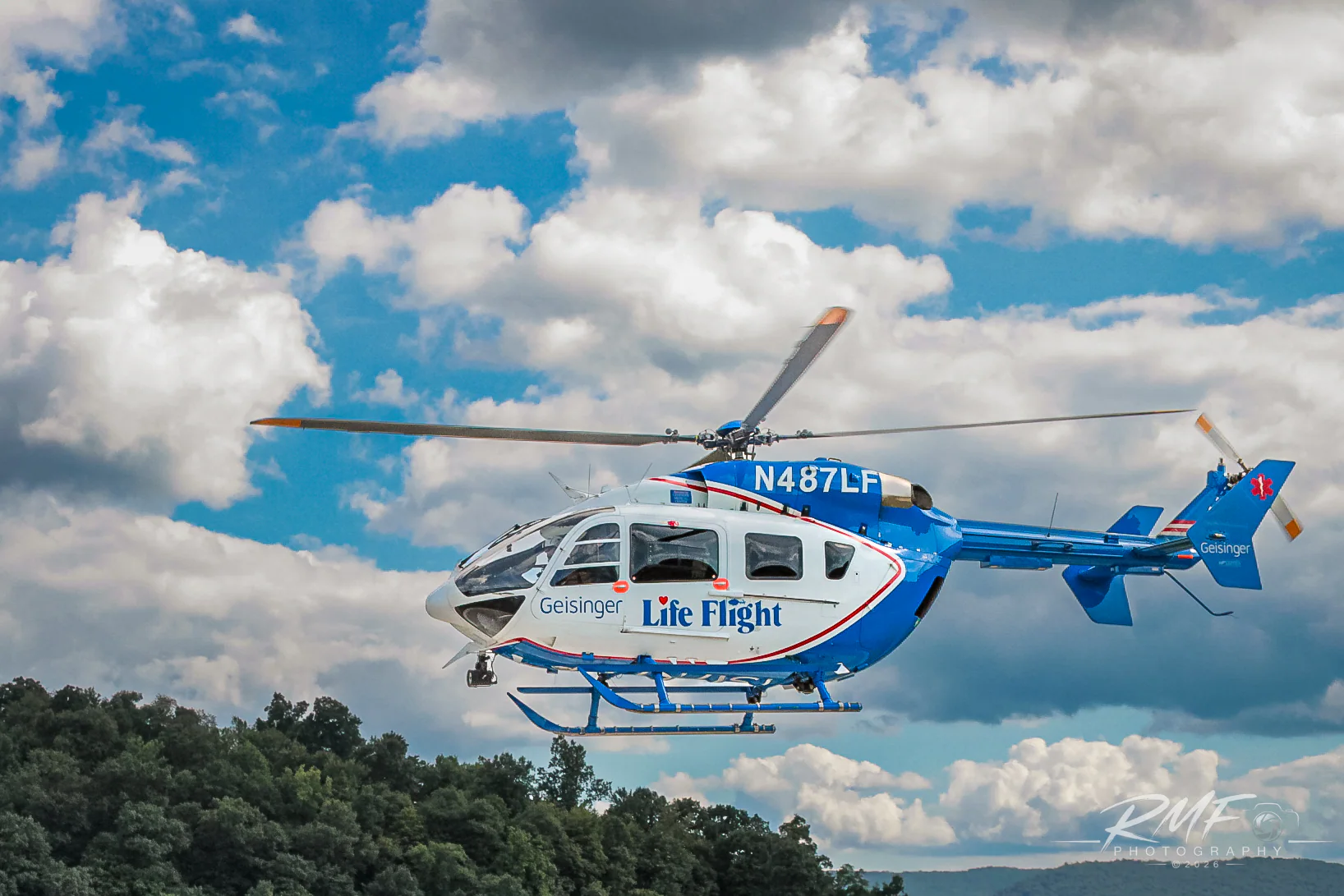 Geisinger Life Flight helicopter flying against a pale sky