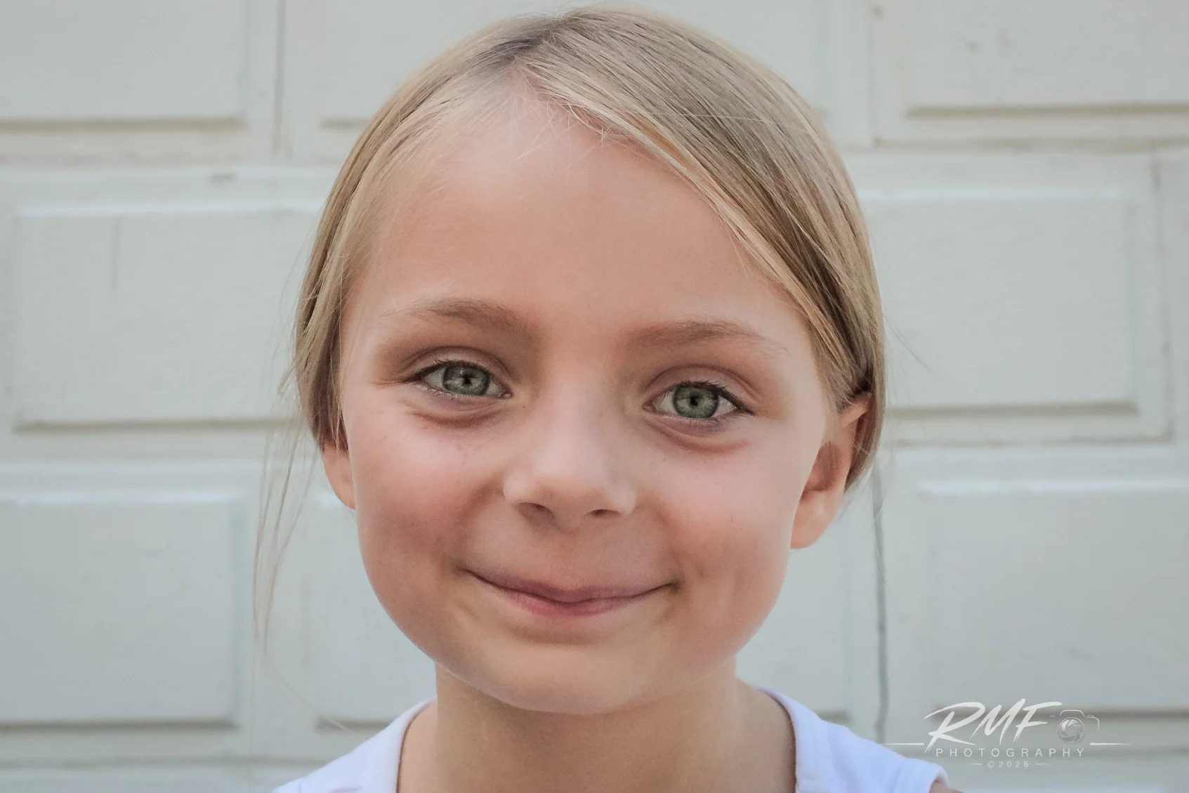 Natural-light portrait of a smiling young girl