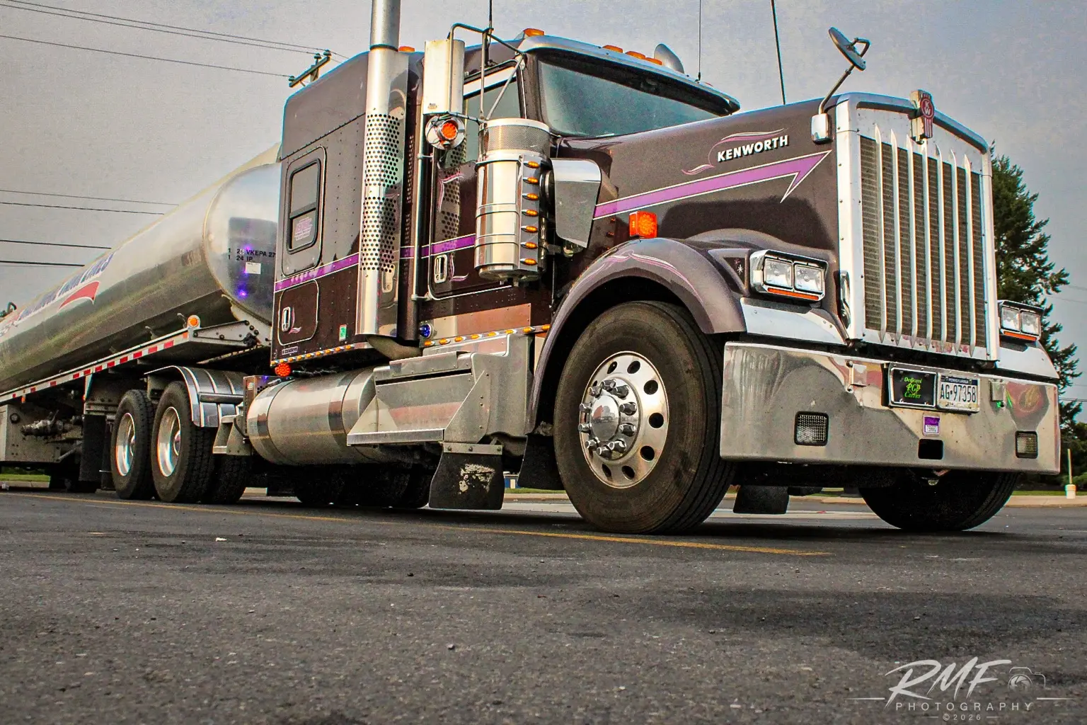 Maroon Peterbilt tanker truck parked in town