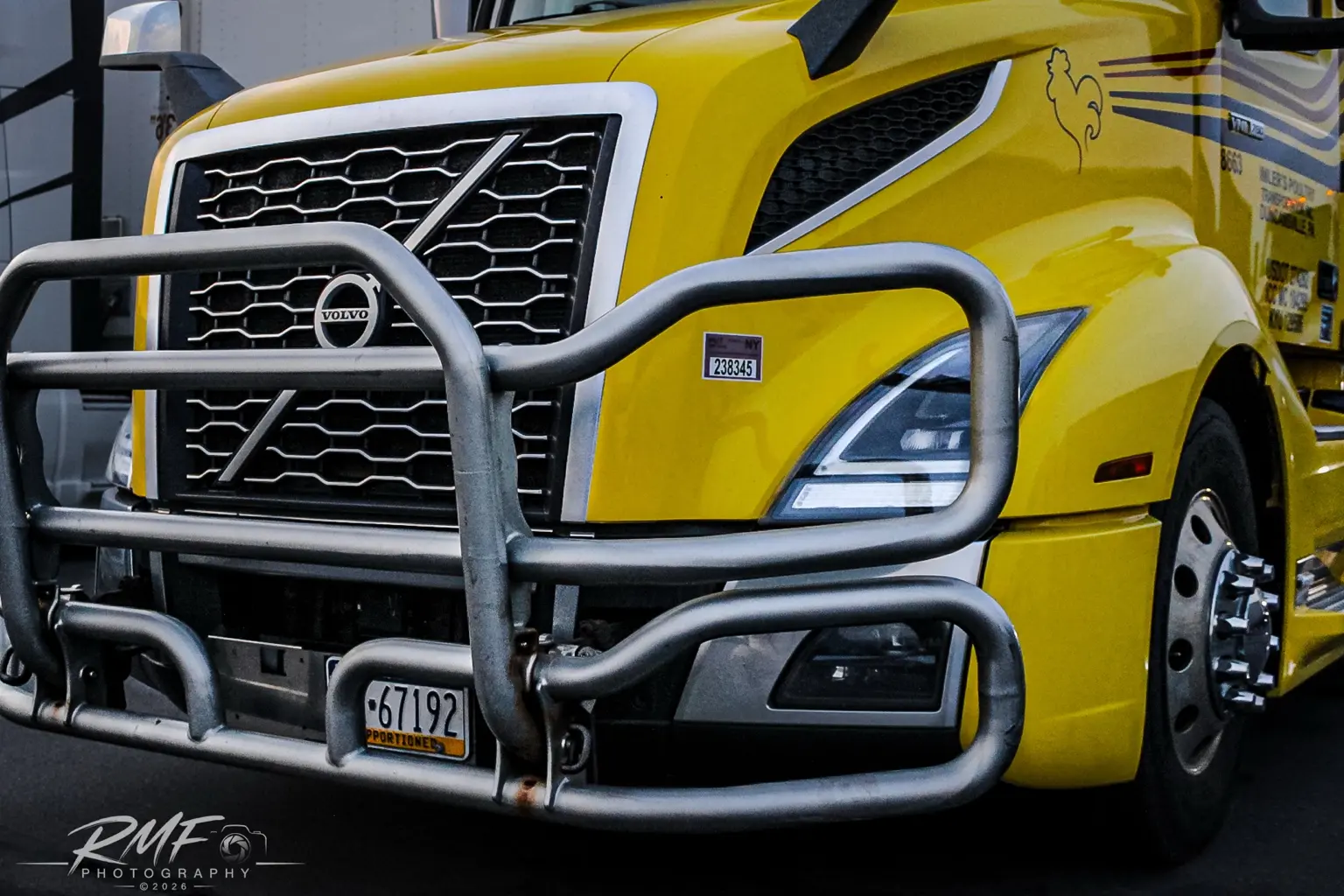 Bright yellow Volvo commercial truck detail