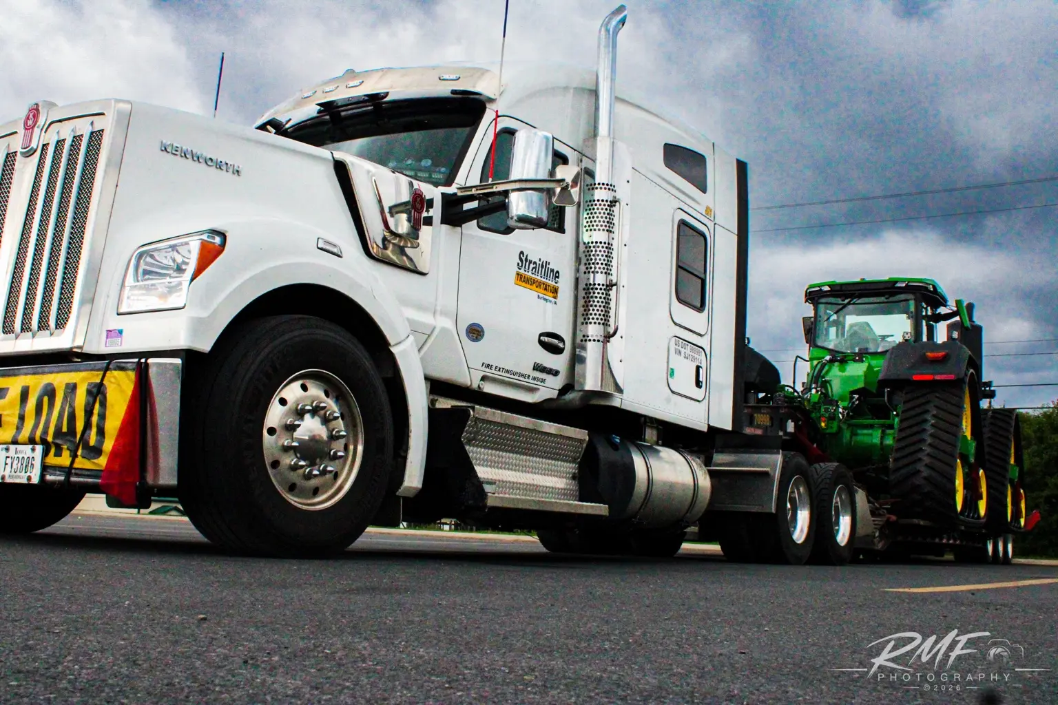 White Western Star truck hauling farm equipment