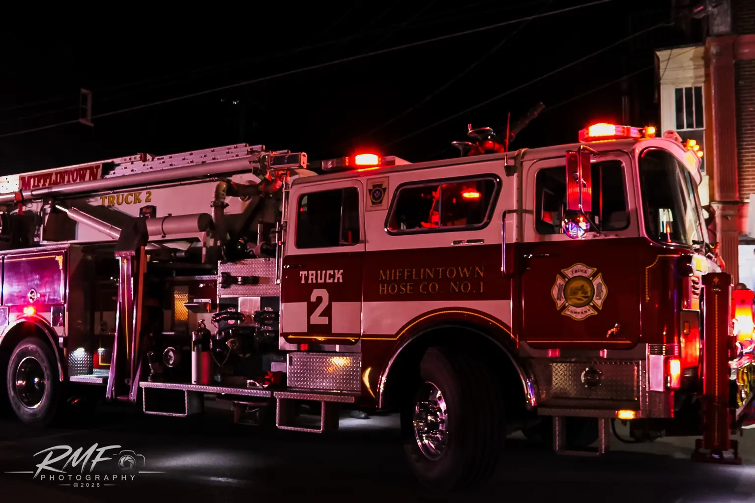 Huntingdon fire truck illuminated at night