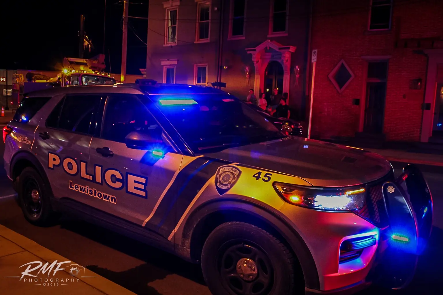 Police vehicle photographed with emergency lights illuminated