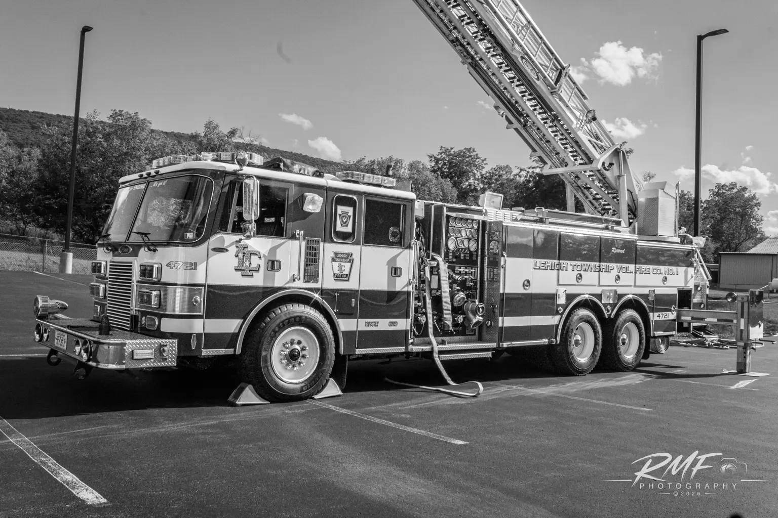 Black-and-white front three-quarter portrait of Lewistown Fire Department Ladder 2