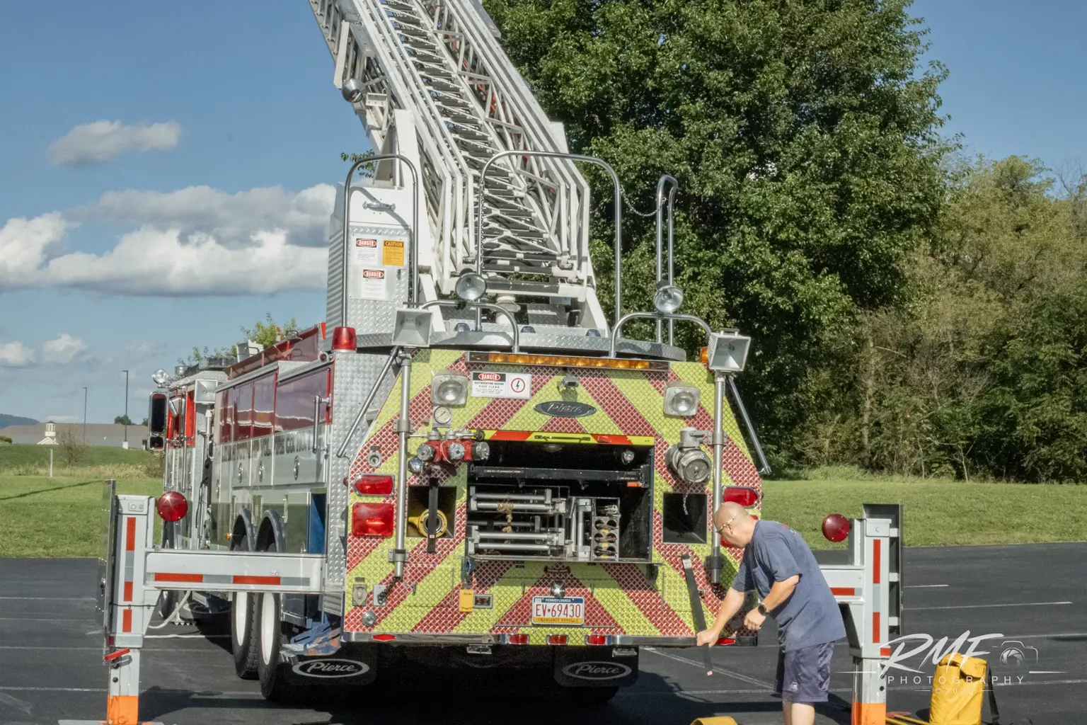 Rear view of Lewistown Fire Department Ladder 2 with its aerial raised