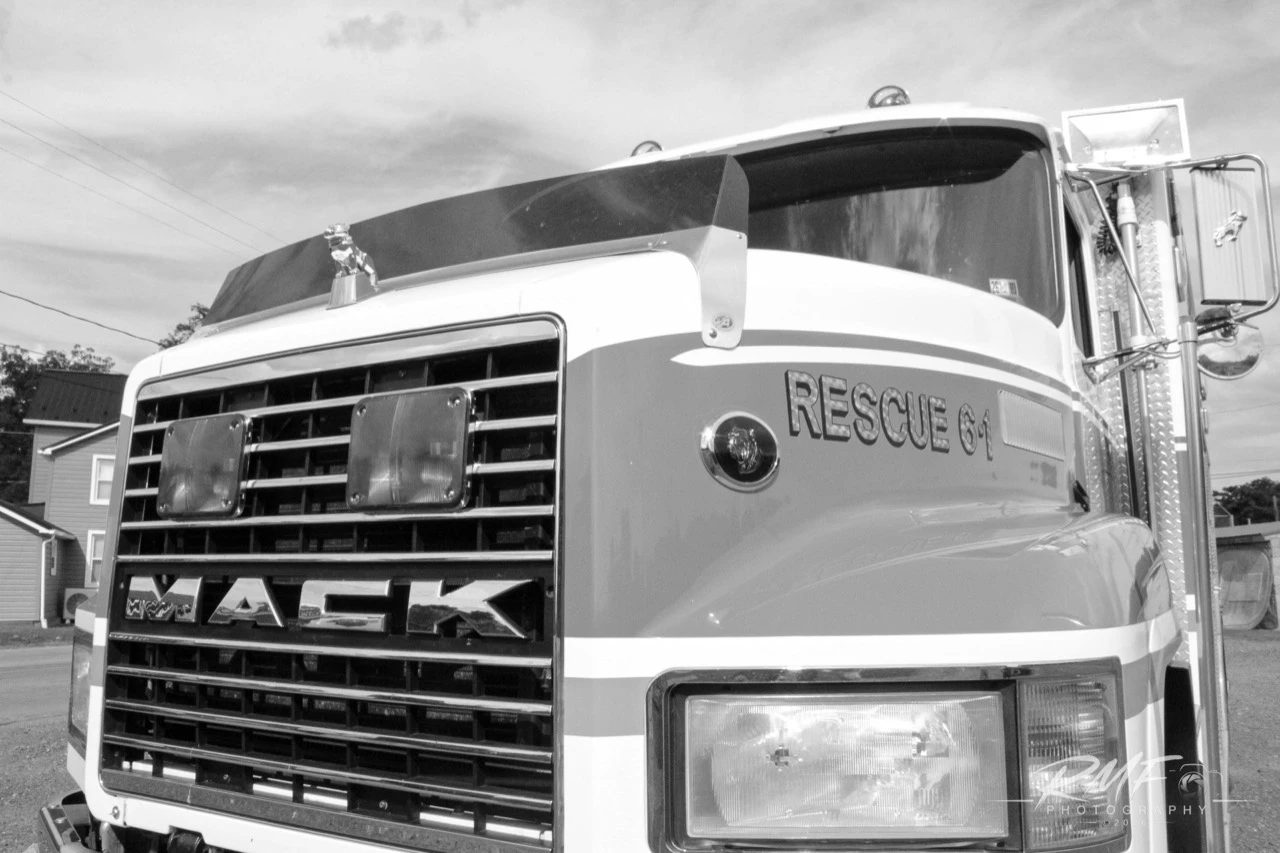 Black-and-white close detail of the Reedsville Rescue 6-1 Mack apparatus